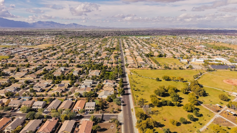 Aerial view of a suburban neighborhood and its main road, showing the kind of master-planned street grid common across Clark County