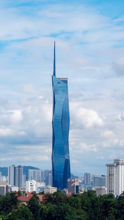 A striking blue skyscraper dominates the city skyline.