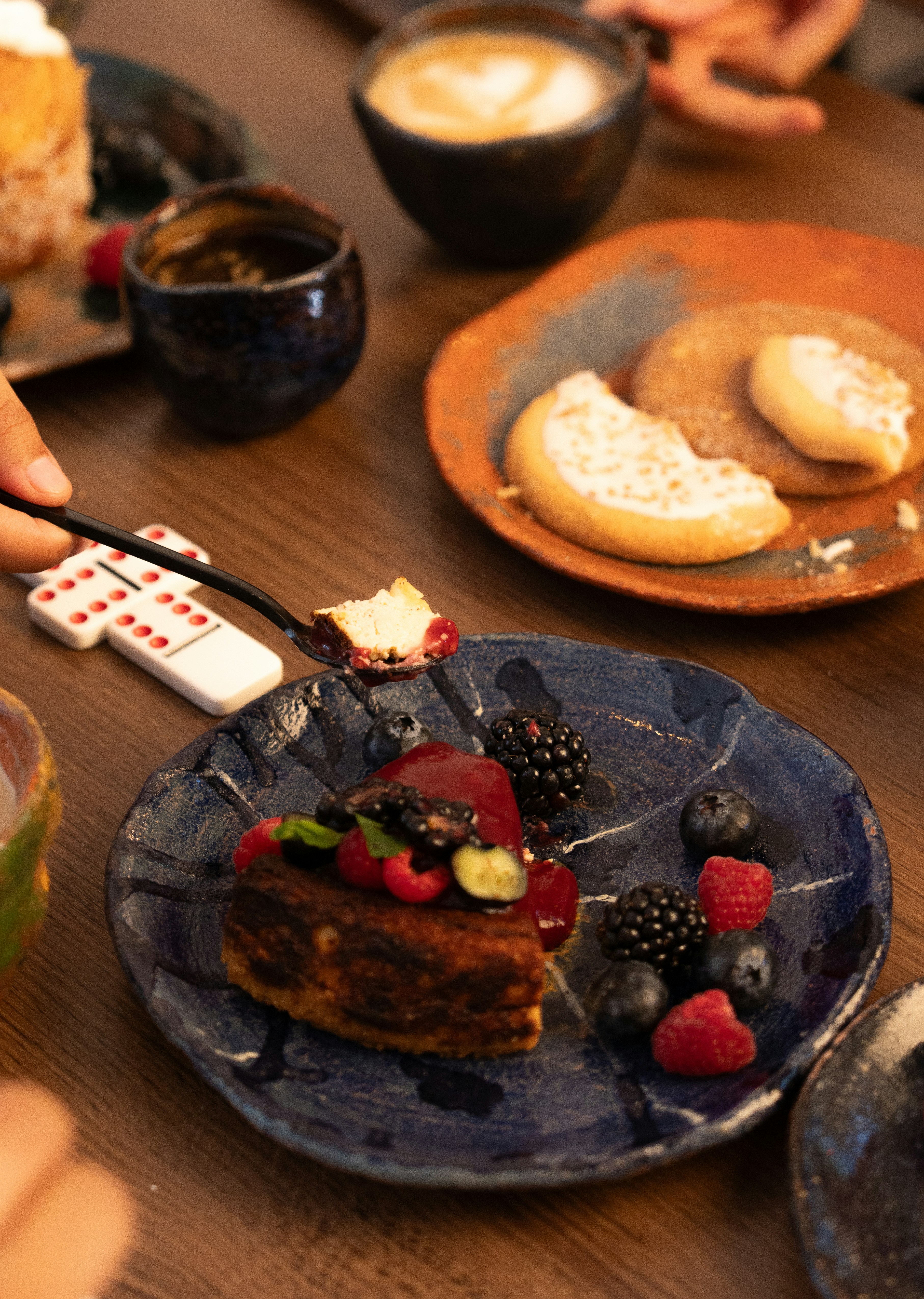 Dessert with berries and sauce on a plate.