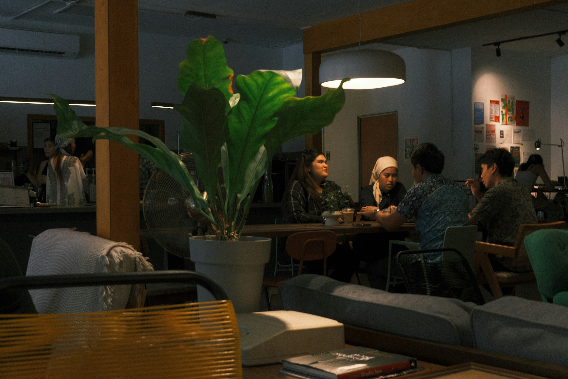 People gathered around a table in a modern office space.