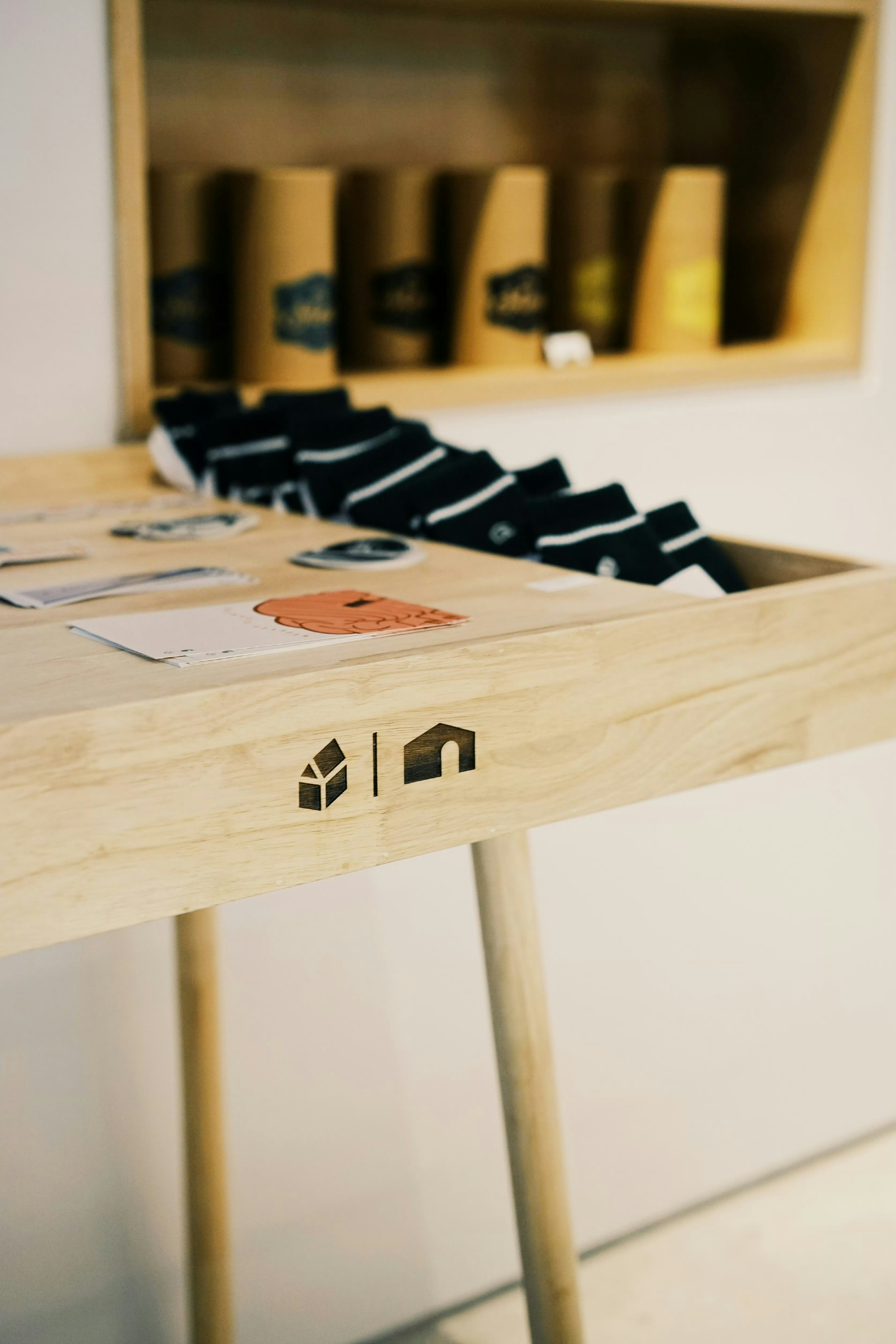 Wooden table displaying socks and small items