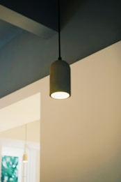 A modern pendant light hangs from the ceiling.