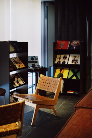 Chairs and vinyl records displayed in a room.