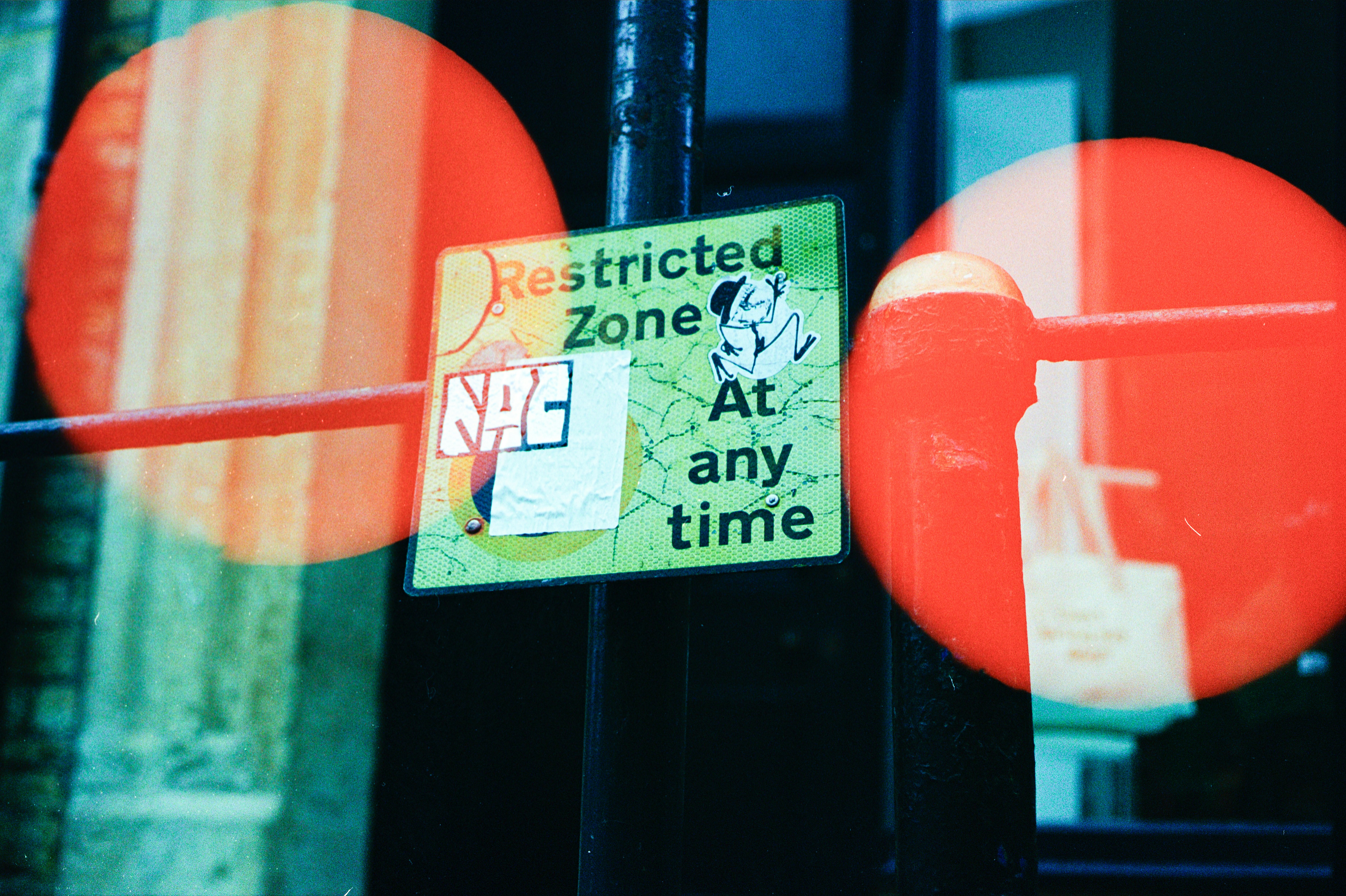 Restricted zone sign with red circular reflections
