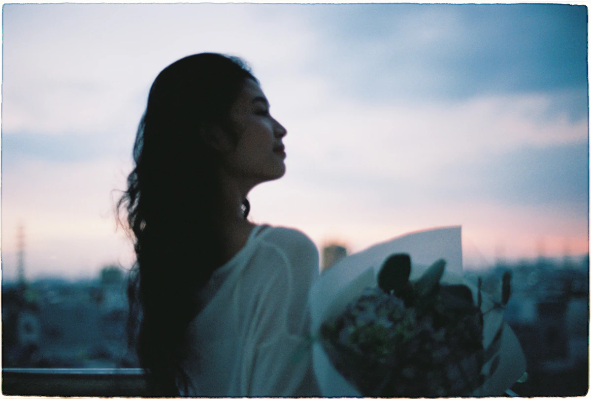 Woman in reflective moment, representing the quiet, high-functioning presentation of many psychiatric conditions