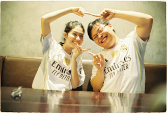 Couple making heart shape with hands