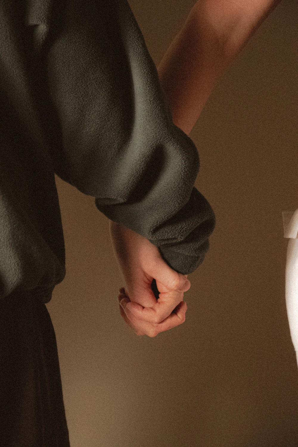 A couple holding hands