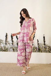 Woman wearing a pink floral print outfit