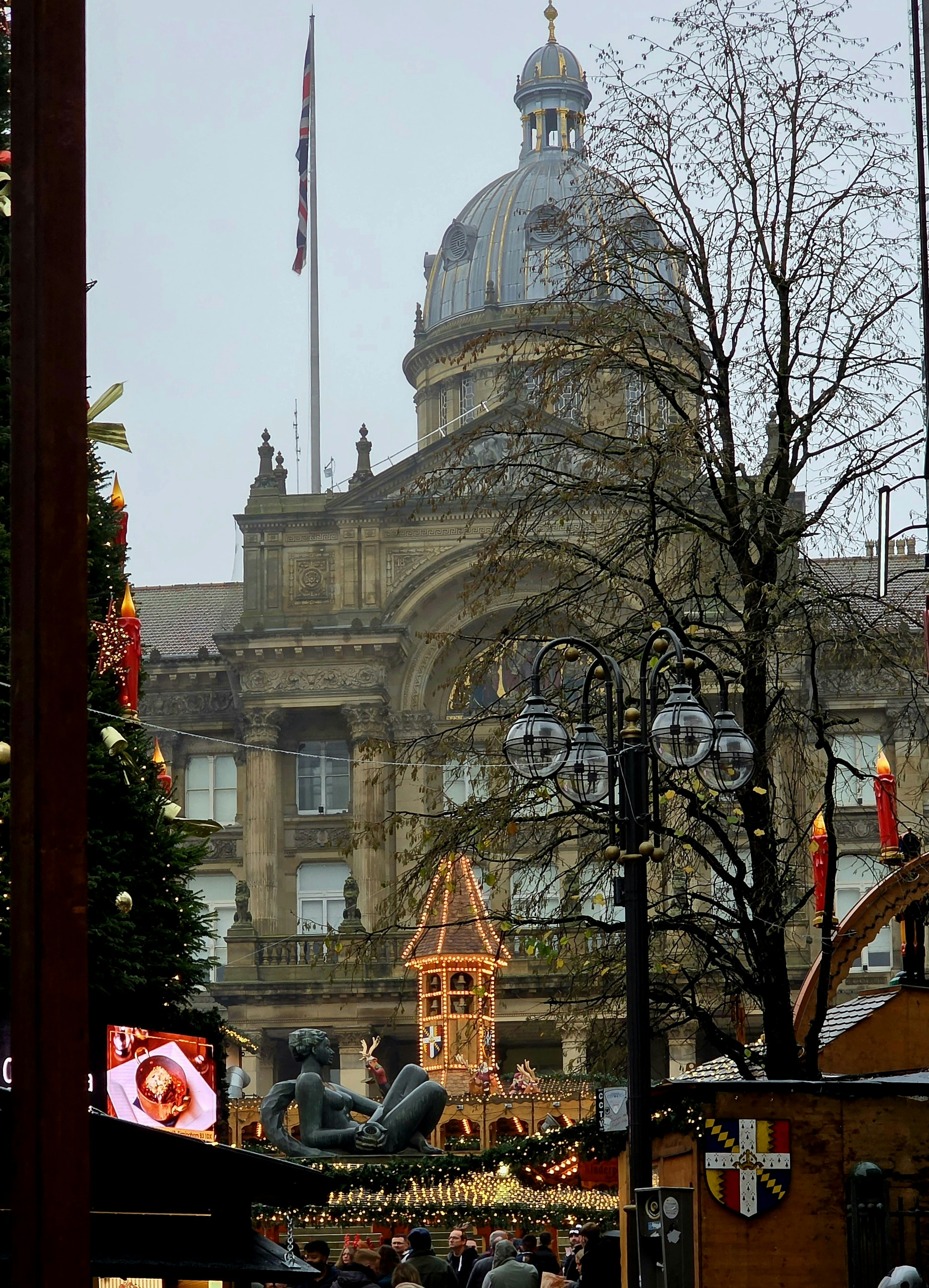 Historic building with christmas market stalls