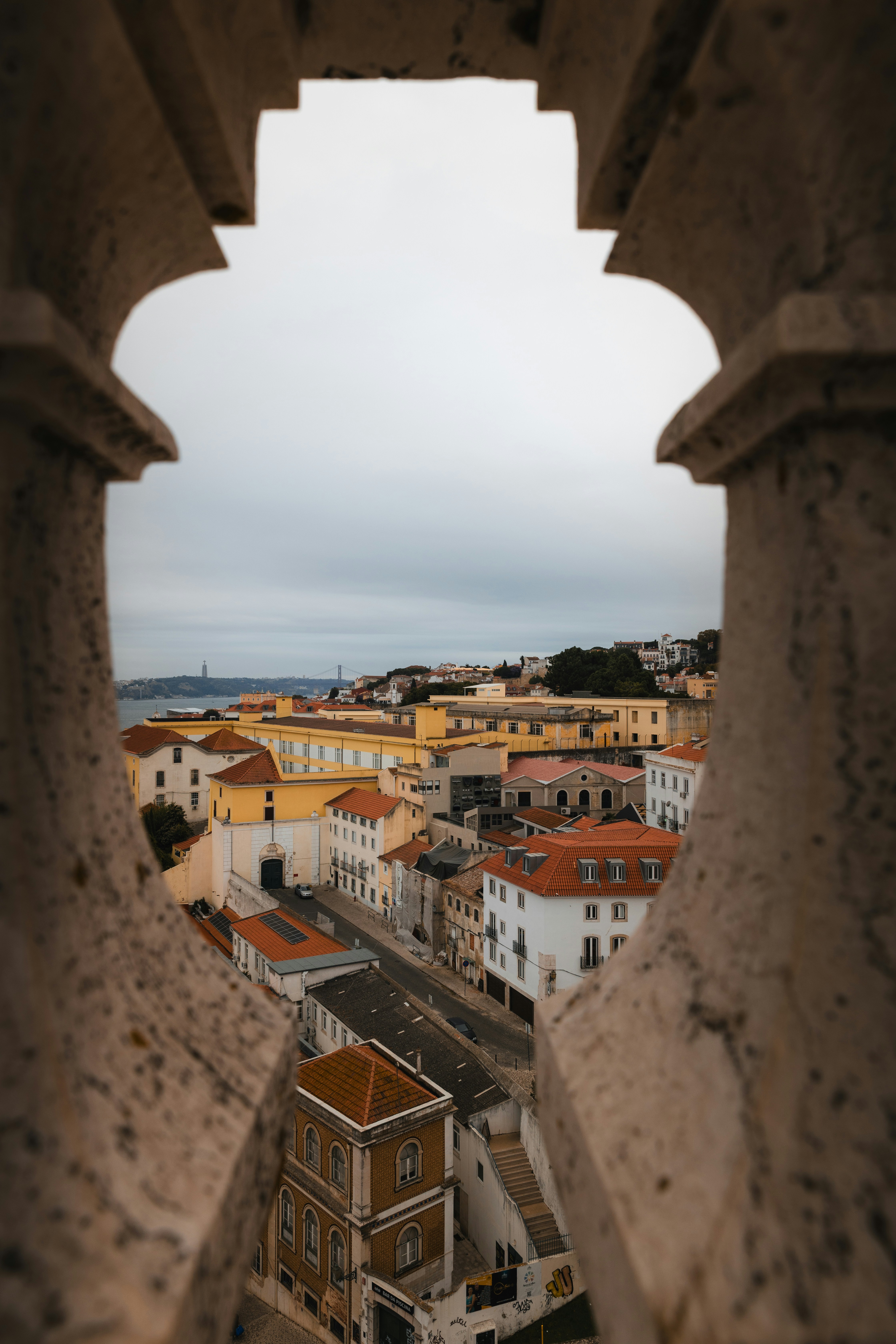 View of a european city through stone arches.