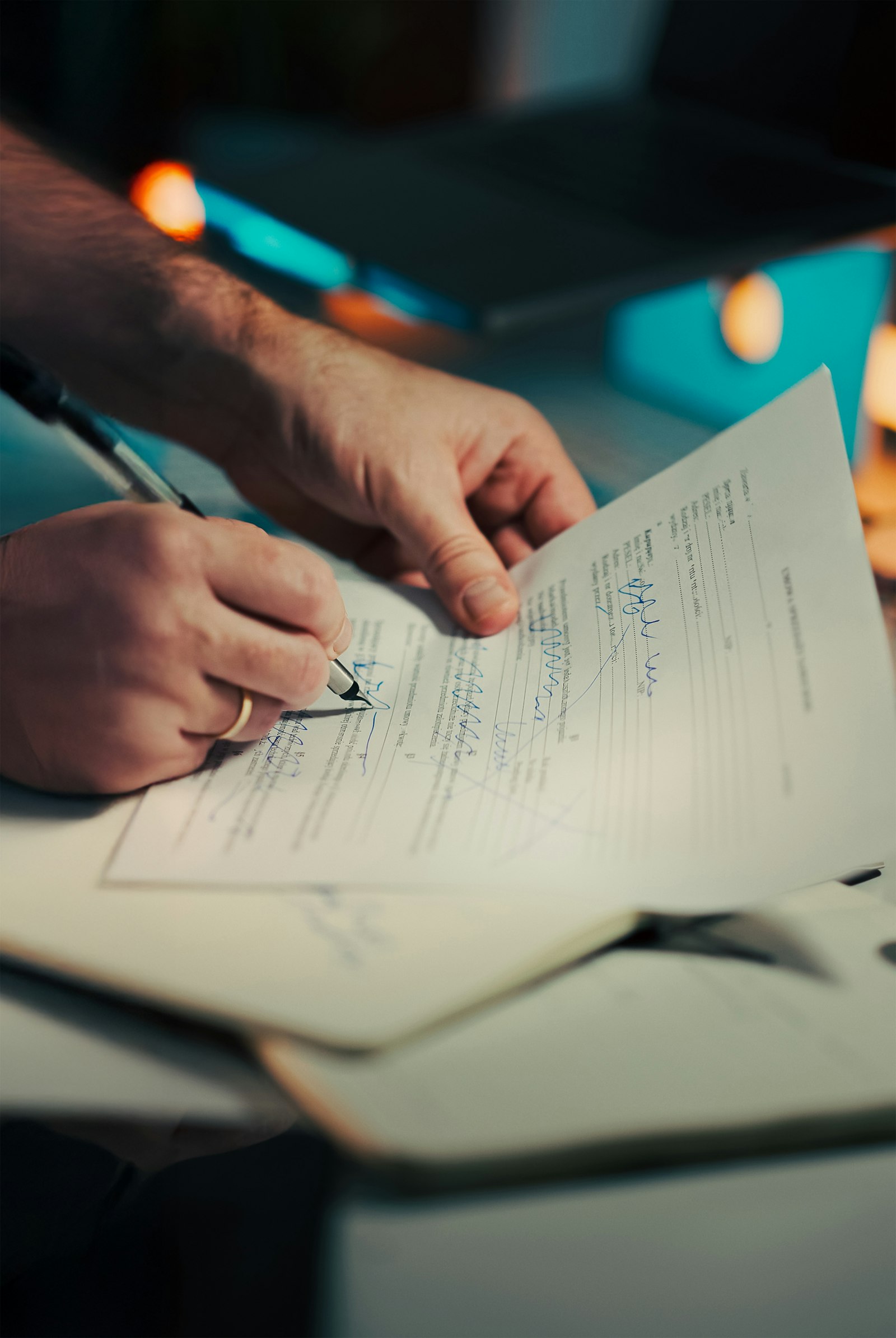 Lawyer signing a contract prepared with AI document drafting tools for lawyers in 2026