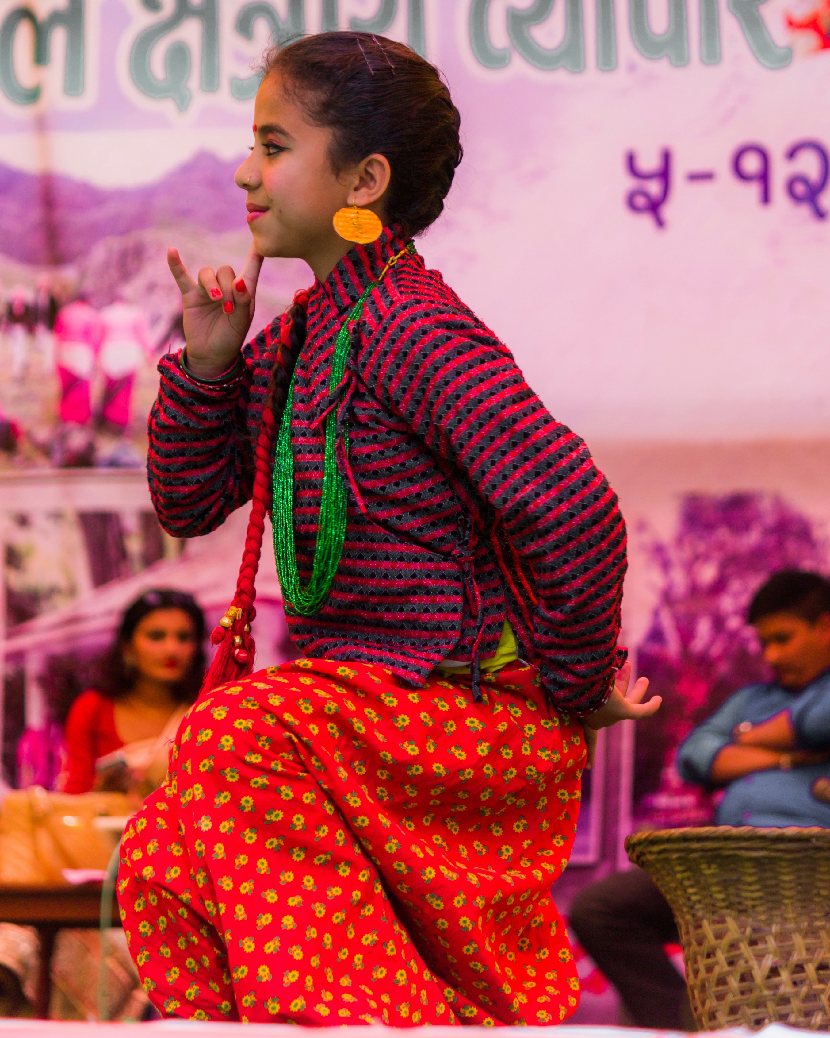 Young girl in traditional attire performing a dance