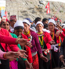 Group of people in traditional clothing dancing