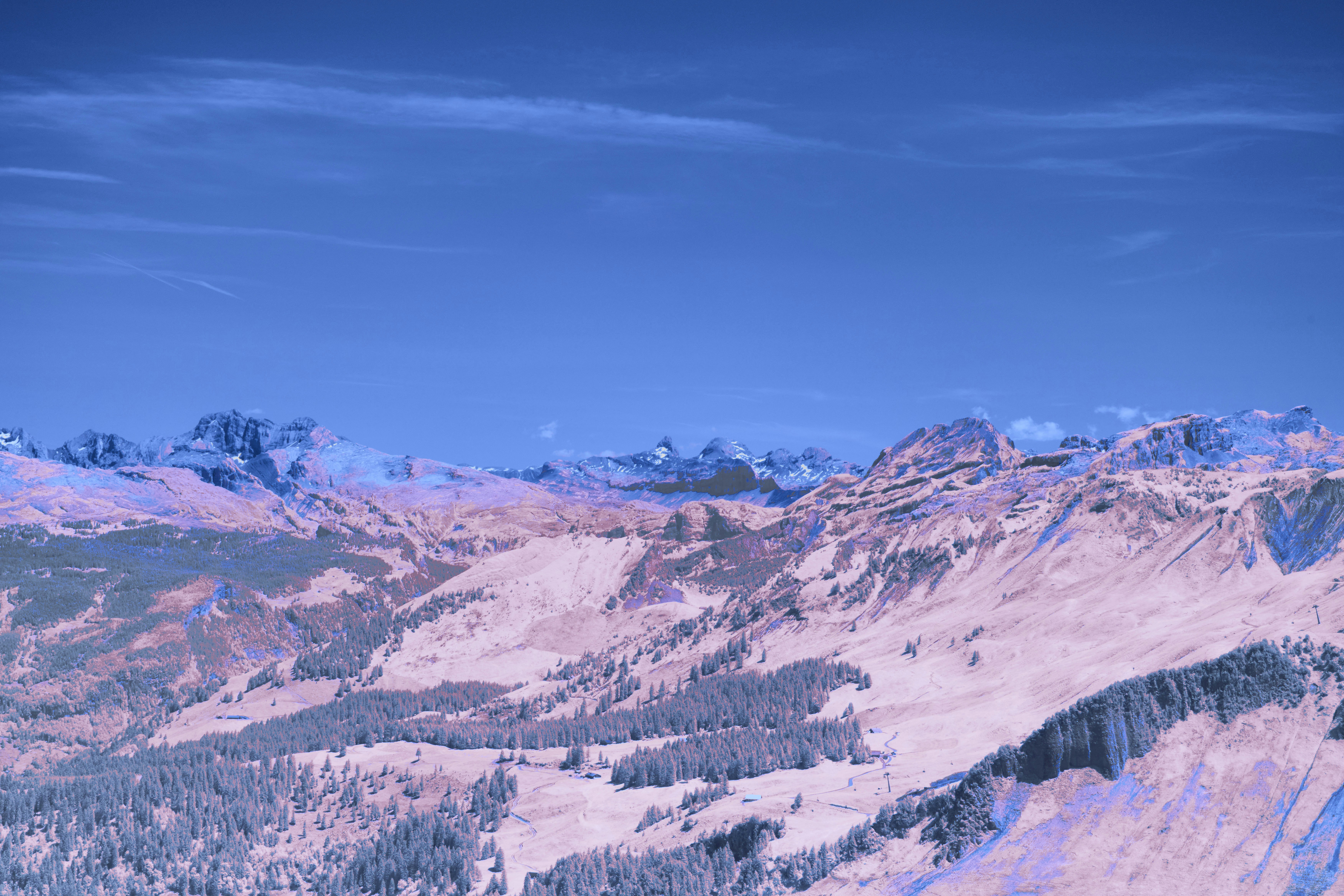 Snowy mountain range under a clear blue sky