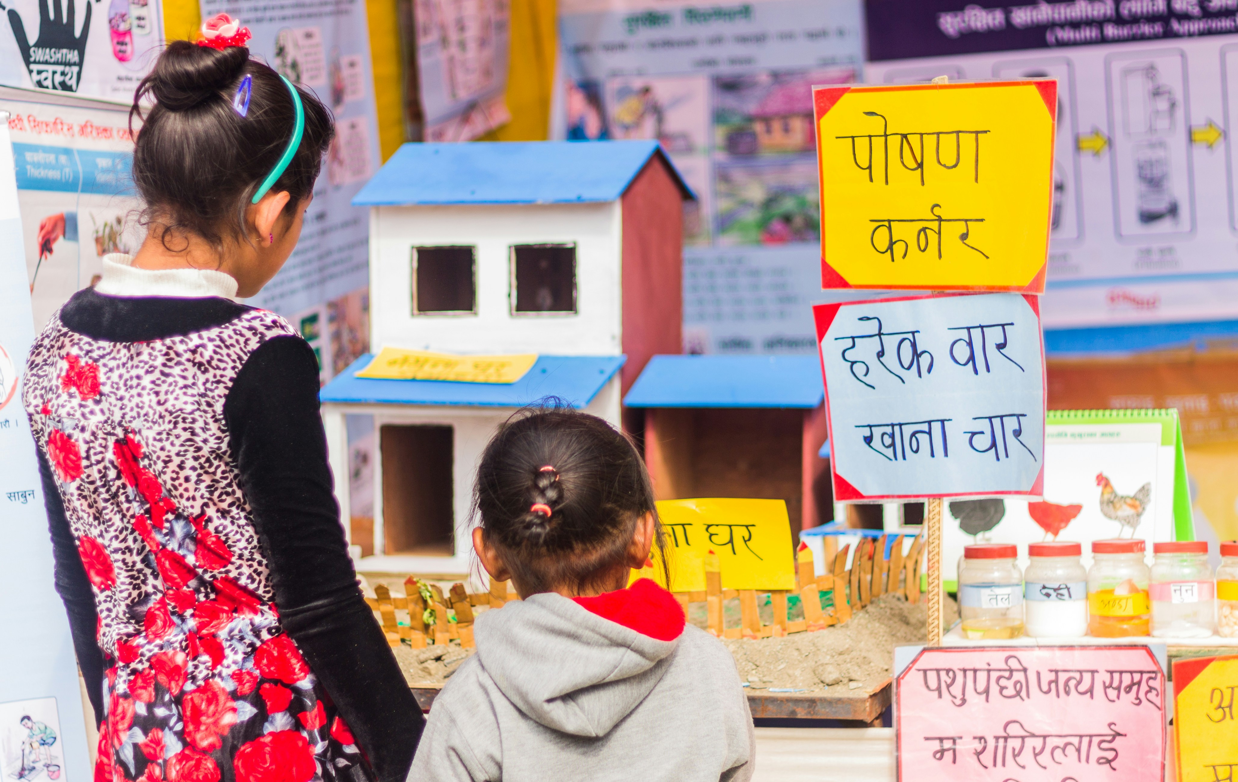 Young siblings exploring stalls at Darchula Mela