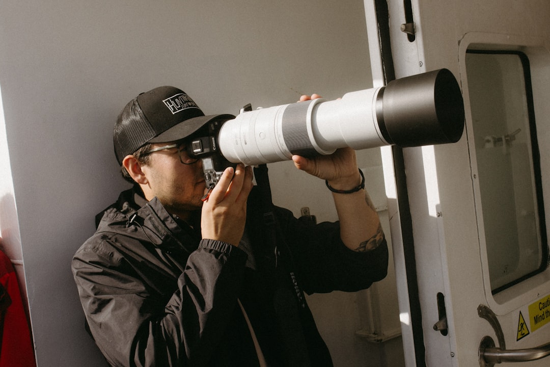 AC maintenance technician inspecting outdoor unit in sunny Miami neighborhood - ac maintenance in miami, fl AC maintenance technician inspecting outdoor unit in sunny Miami neighborhood - ac maintenance in miami, fl