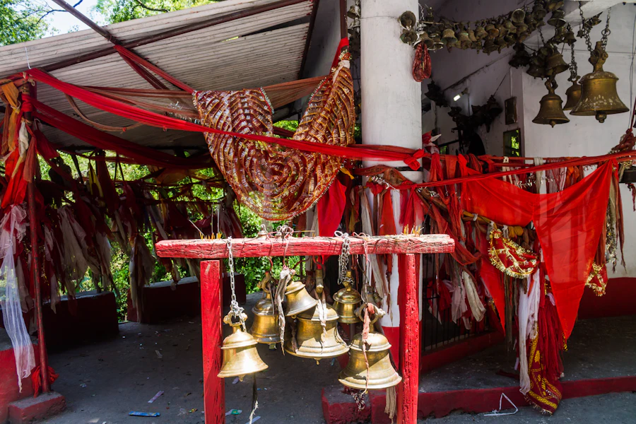 Hundreds of brass bells hanging at a Himalayan shrine