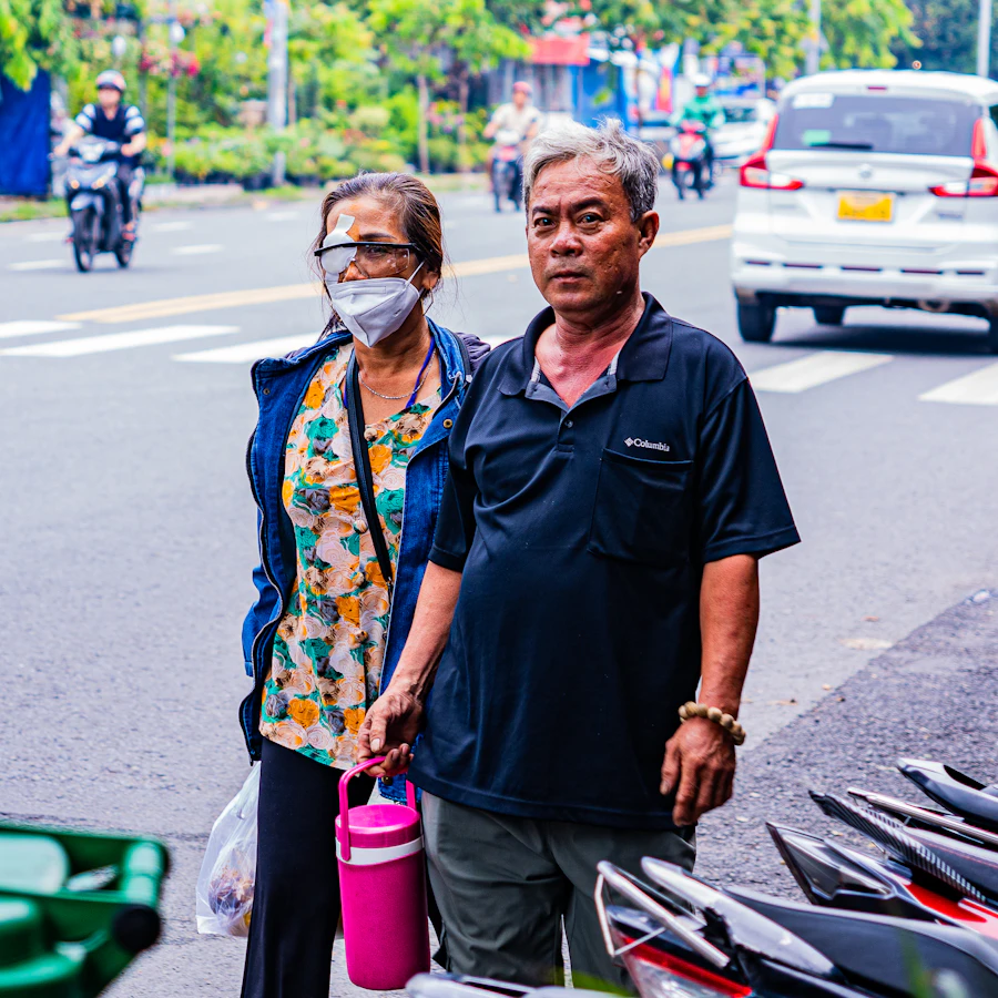 Mature couple holding hands while walking together.