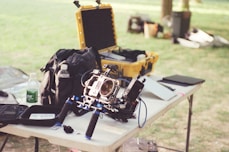 Professional camera equipment on a table outdoors