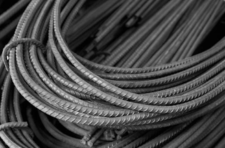 Coiled steel rebar rods in a pile