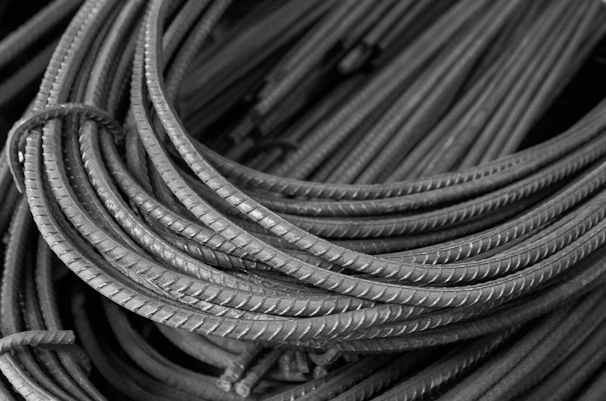 Coiled steel rebar rods in a pile