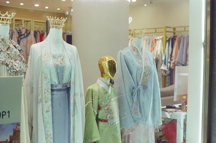 Mannequins display traditional chinese clothing in a store