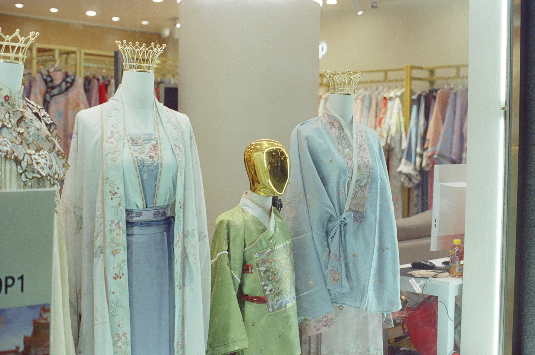 Mannequins display traditional chinese clothing in a store