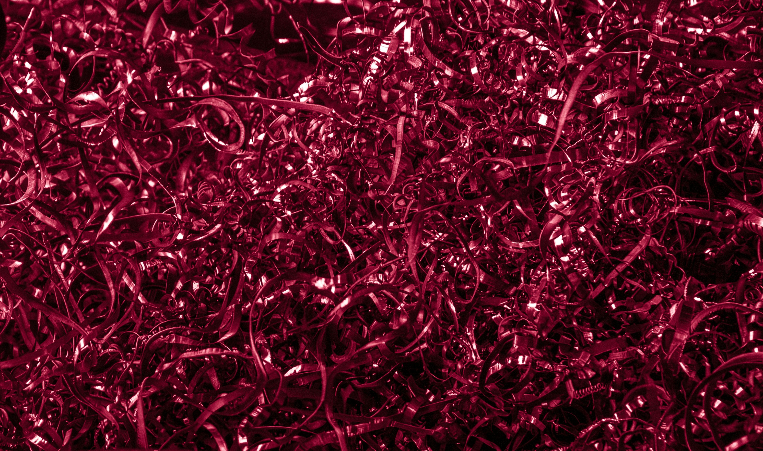 Red metal swirl texture background/wallpaper for mobile phones. Note: This is part of a series of experimental background texture images I have made using photos from my travels in Mumbai.