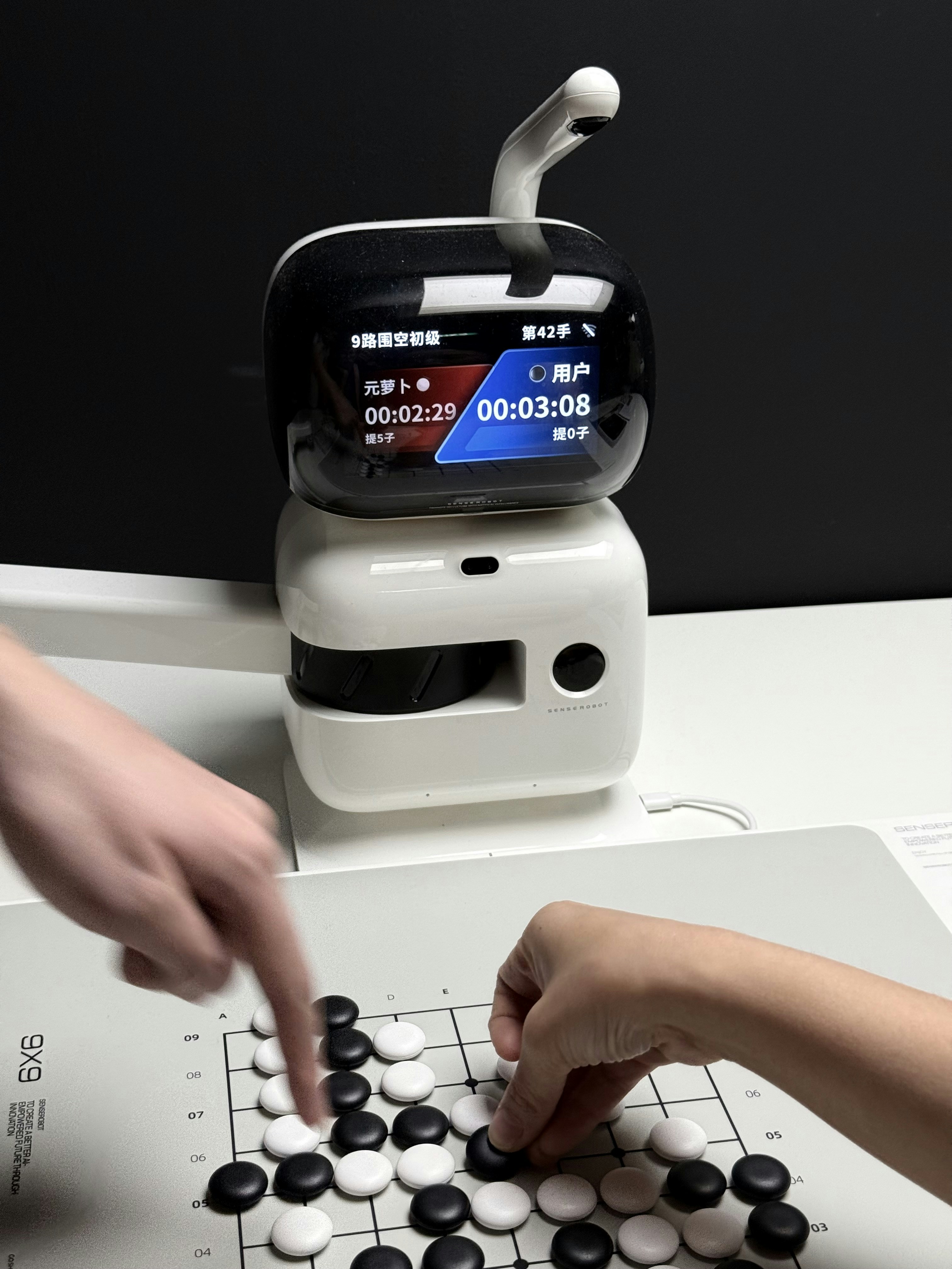 A person pointing at a screen with AI strategy diagrams.