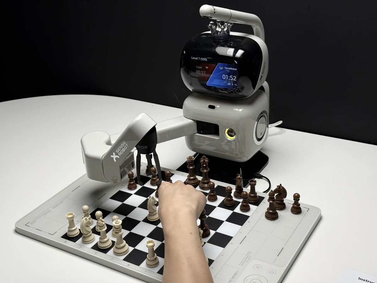 Robot arm playing chess representing AI versus human strategy