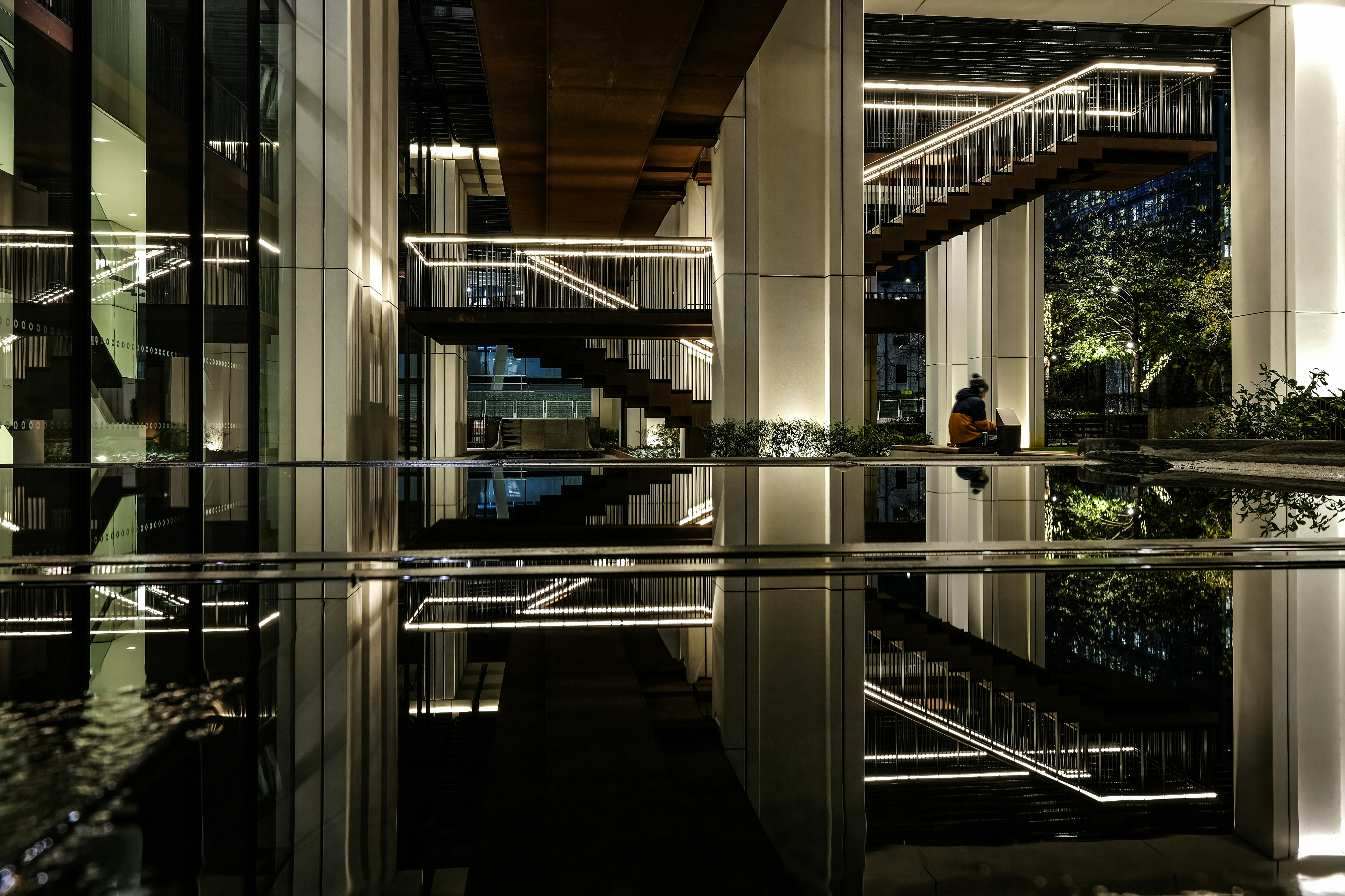 Modern building interior with reflective water feature