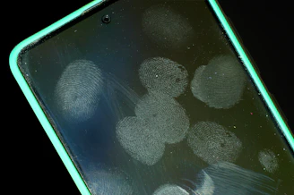 Smudged smartphone screen with fingerprints