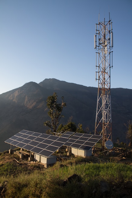 Solar panels and cell tower on a mountain