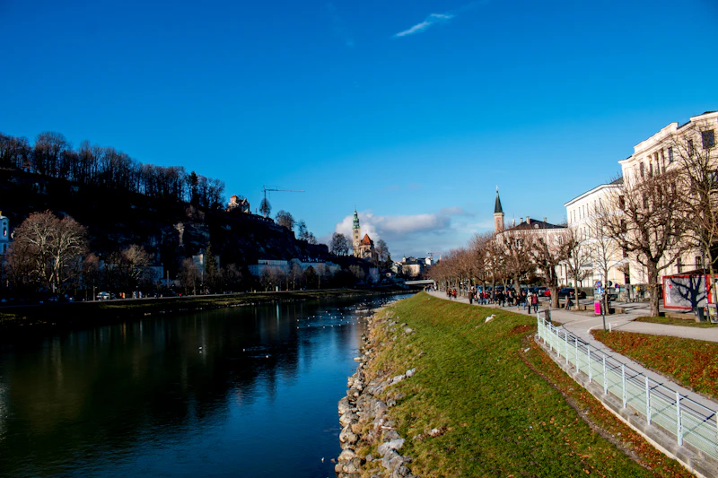 Salzburg buildings along the Salzach on a clear day