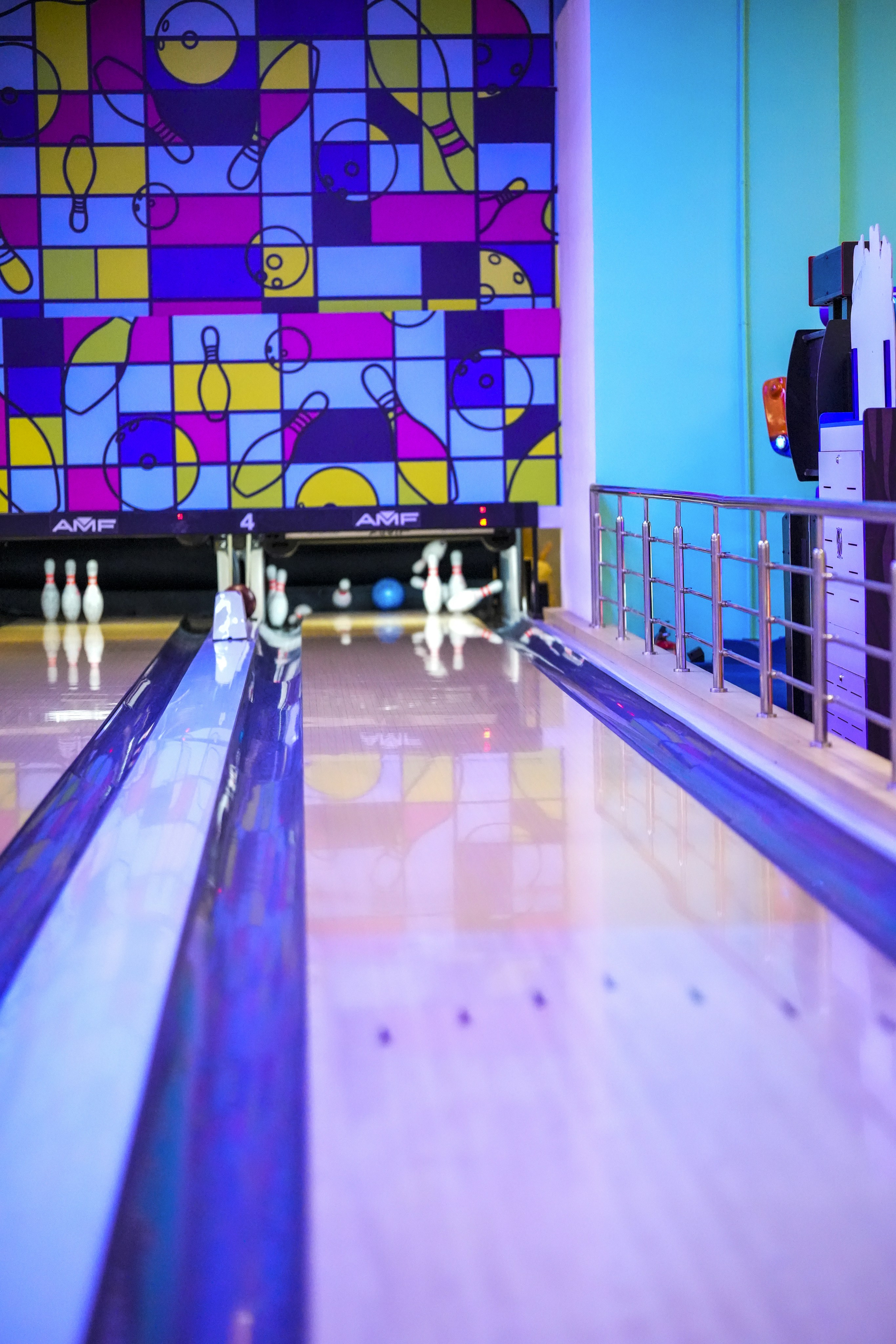 Bowling alley with colorful walls and pins