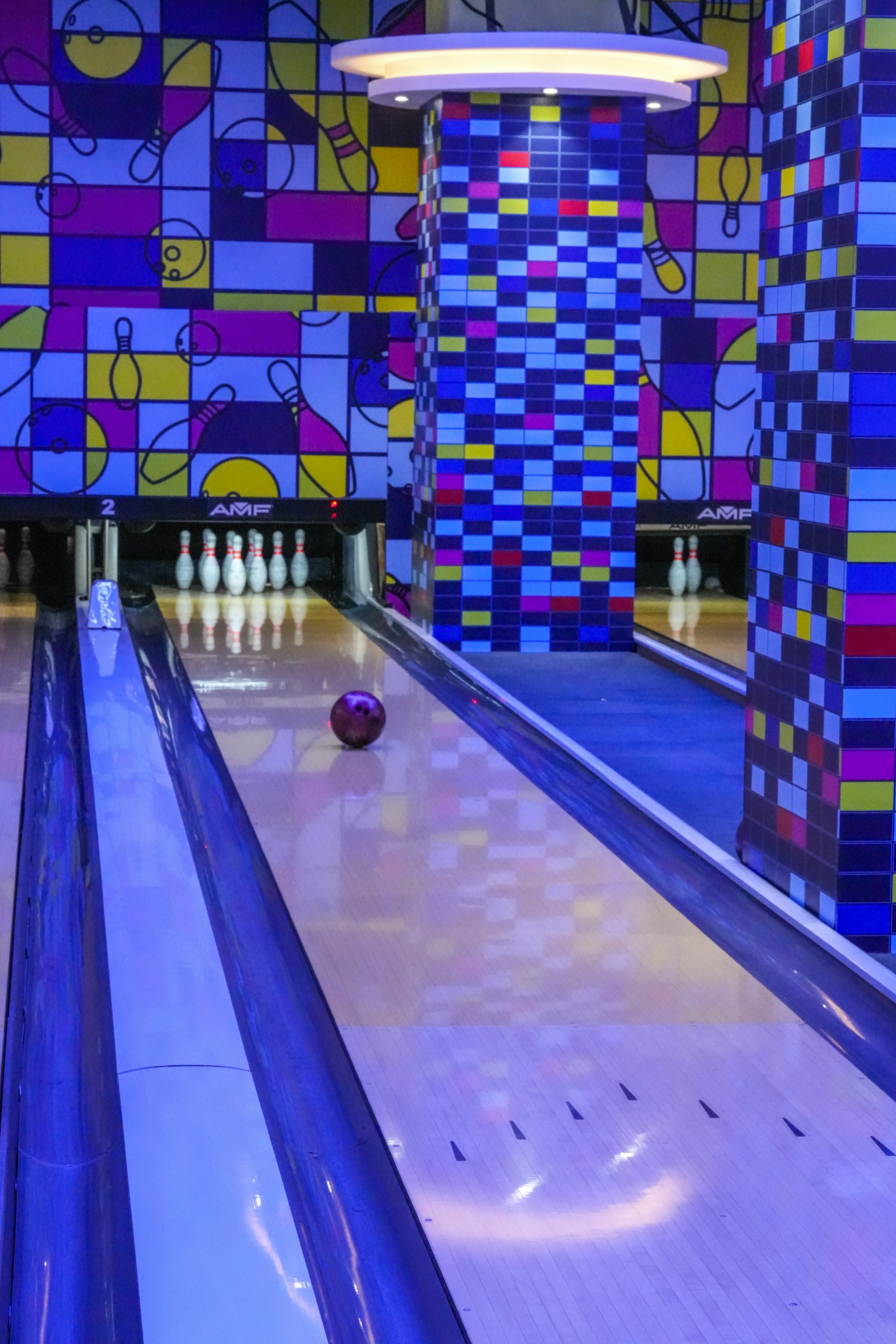 Bowling alley with colorful geometric wall art
