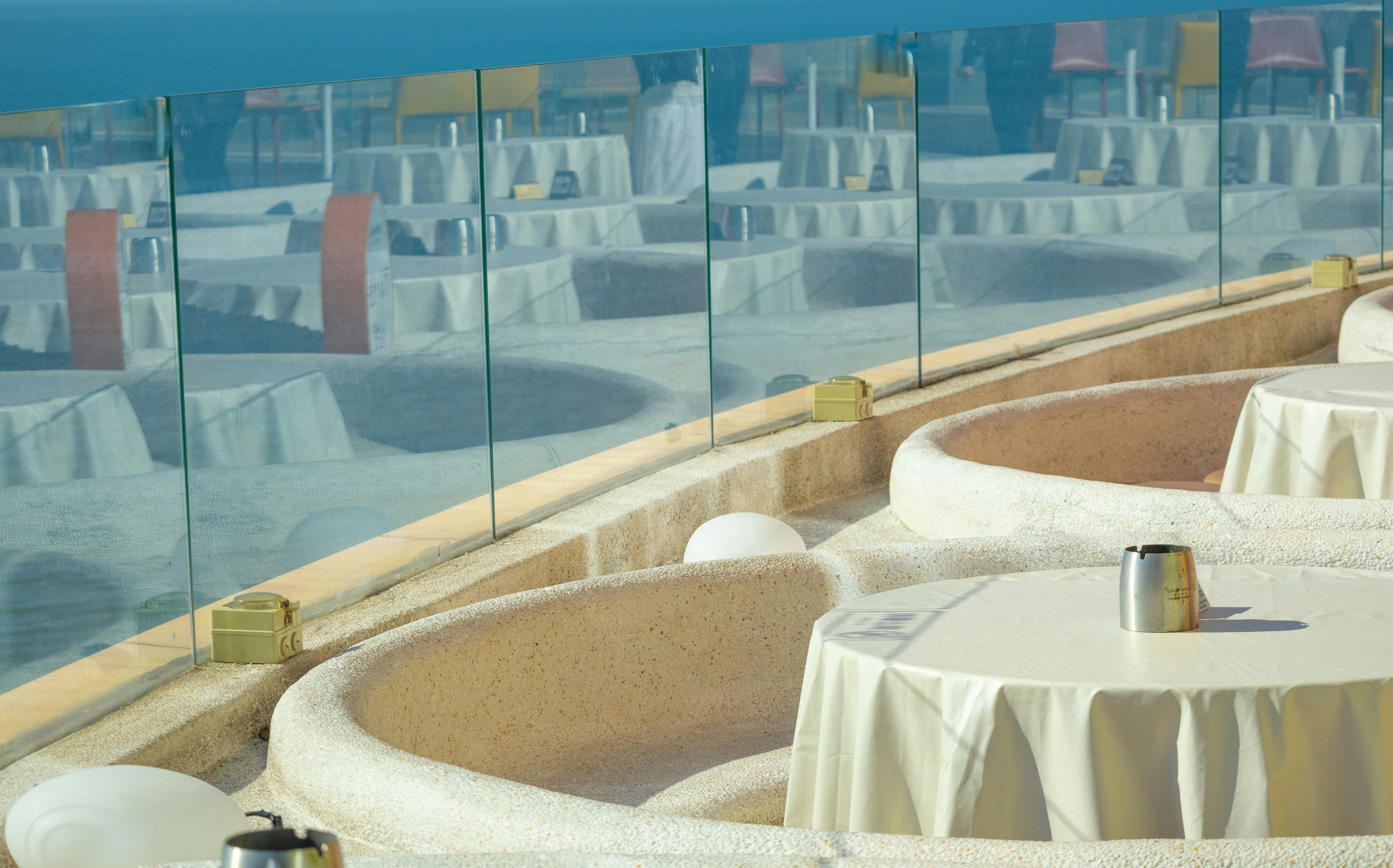 Outdoor cafe seating with ocean view