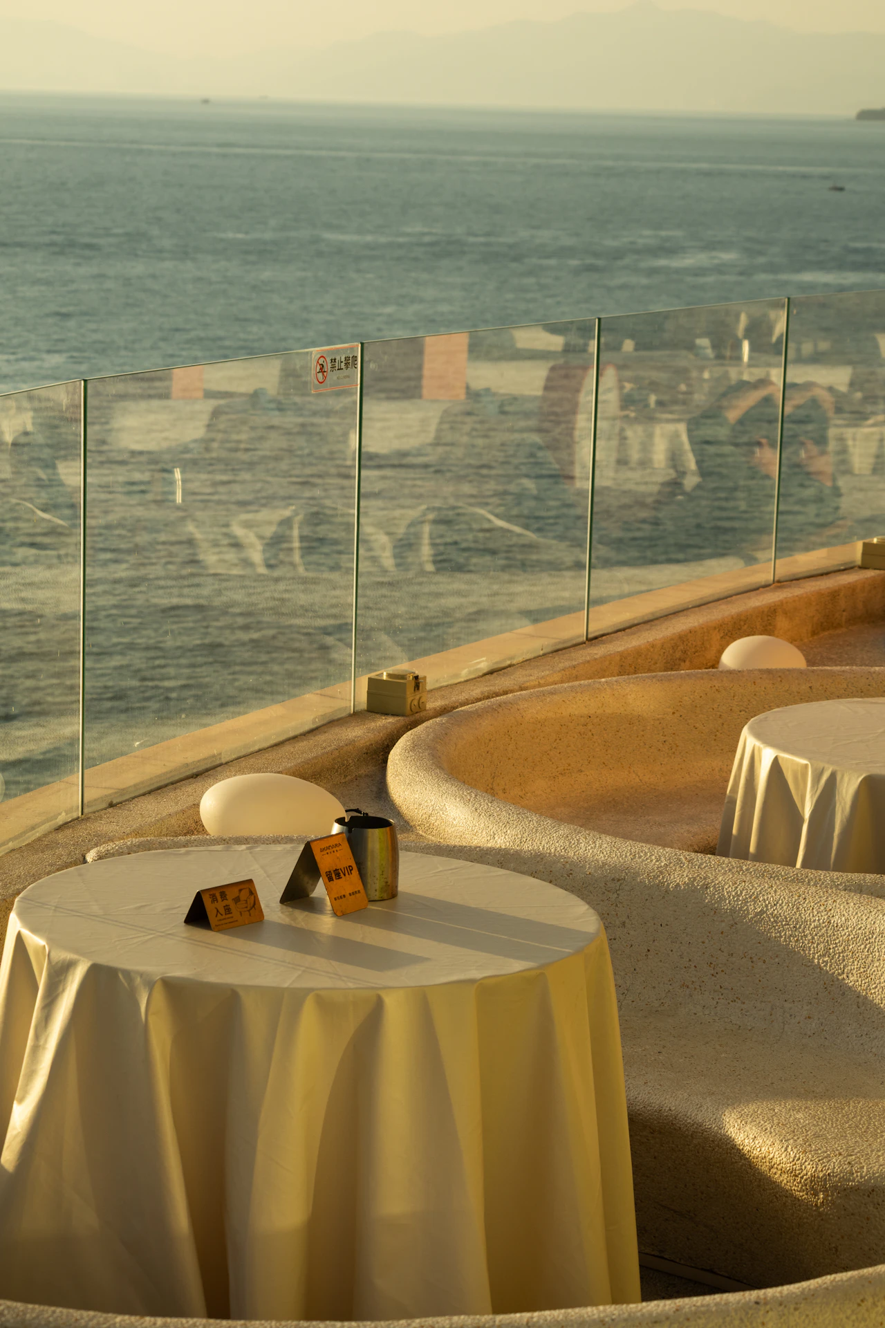 A long table laid at the water's edge