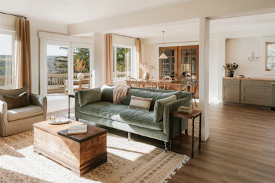 Cozy living room with plush sofa and wooden chest.