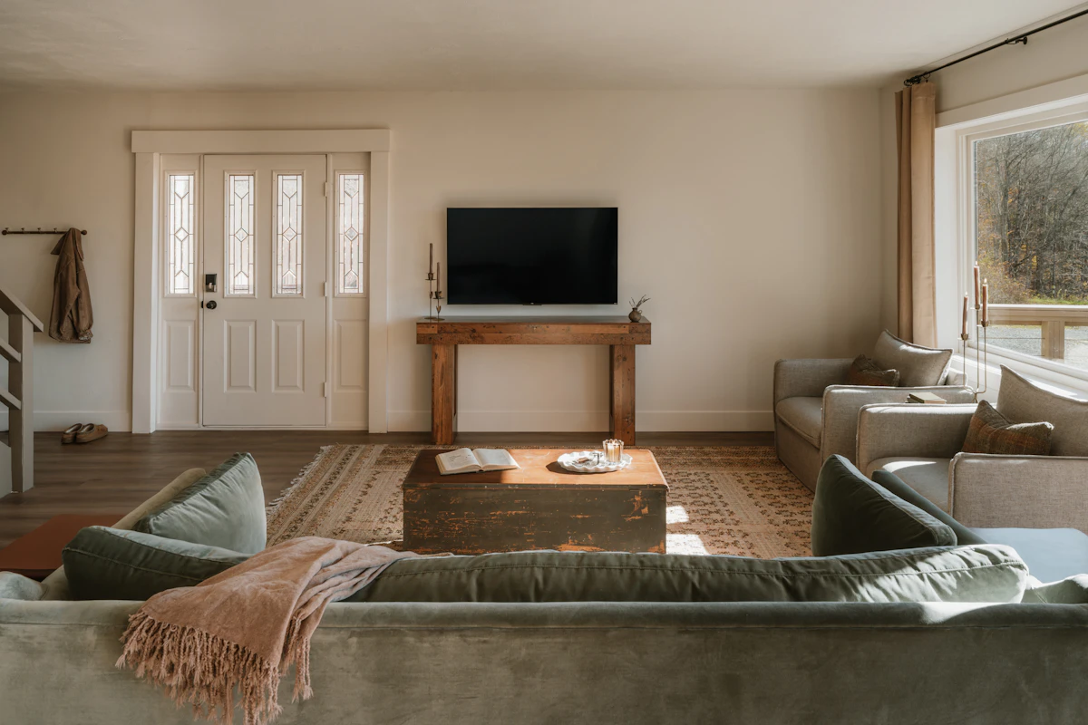 A warm, considered living room, the kind of space an initial consultation begins with