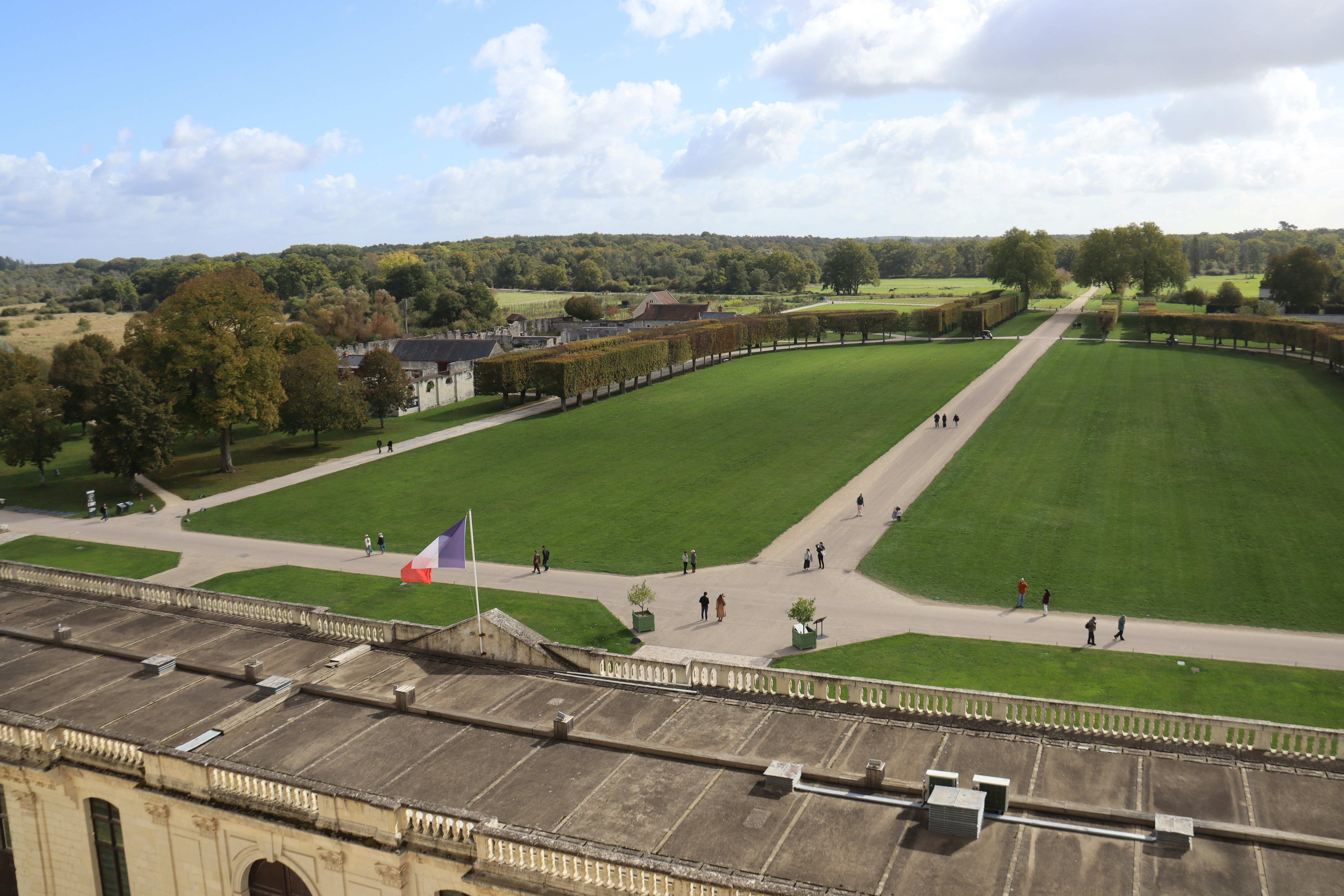 Grand formal gardens with a french flag flying