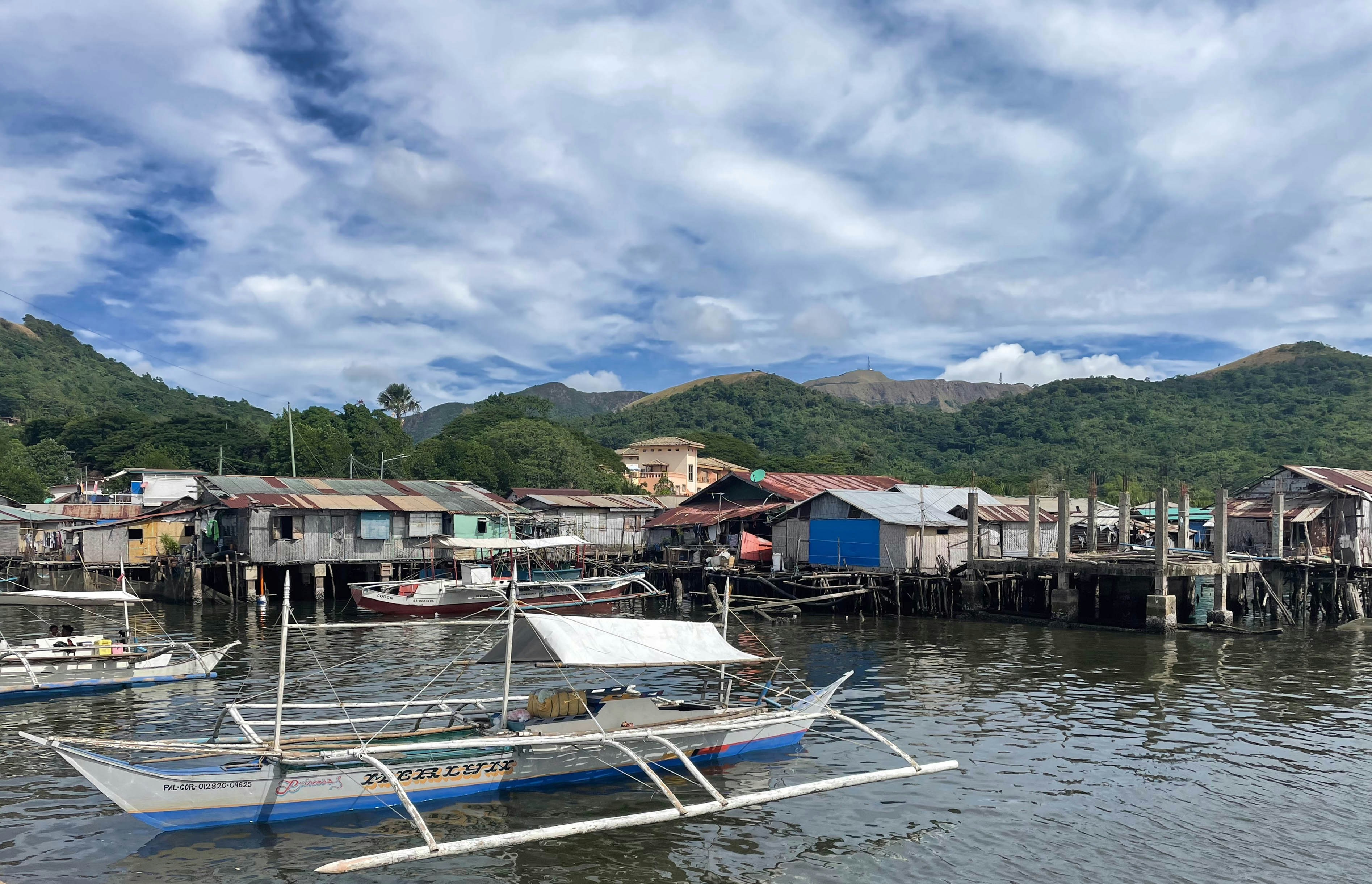 Stilted houses and boats on the water