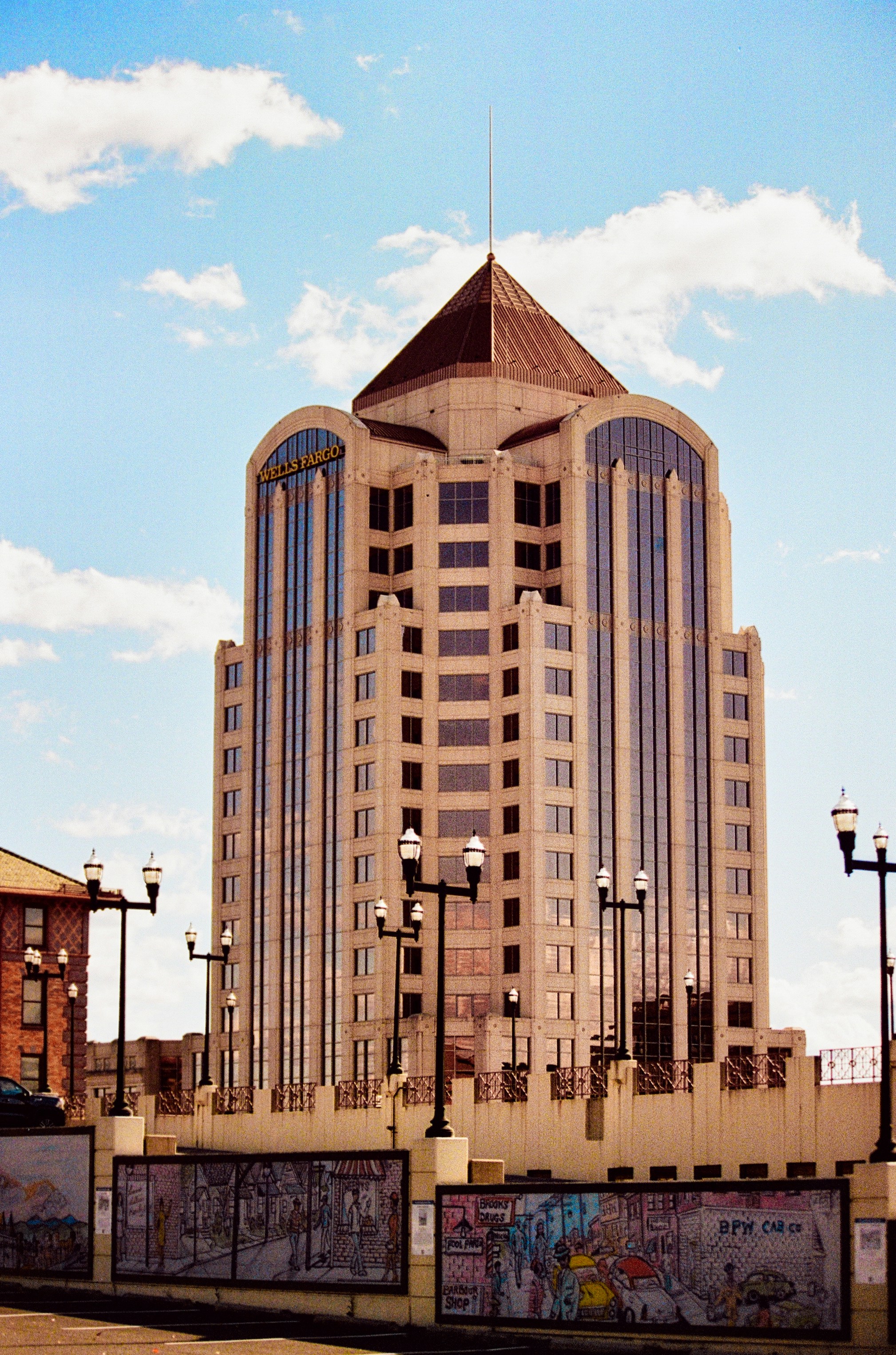 Tall office building under a cloudy blue sky near Arlington, Virginia