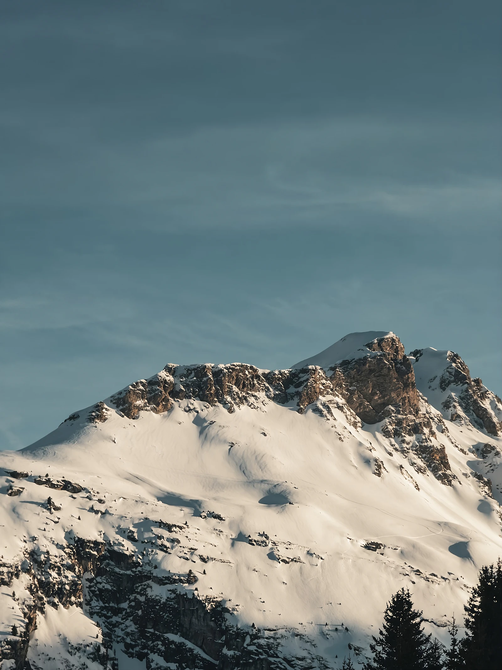 Snow-covered peaks above Courchevel under a clear blue sky