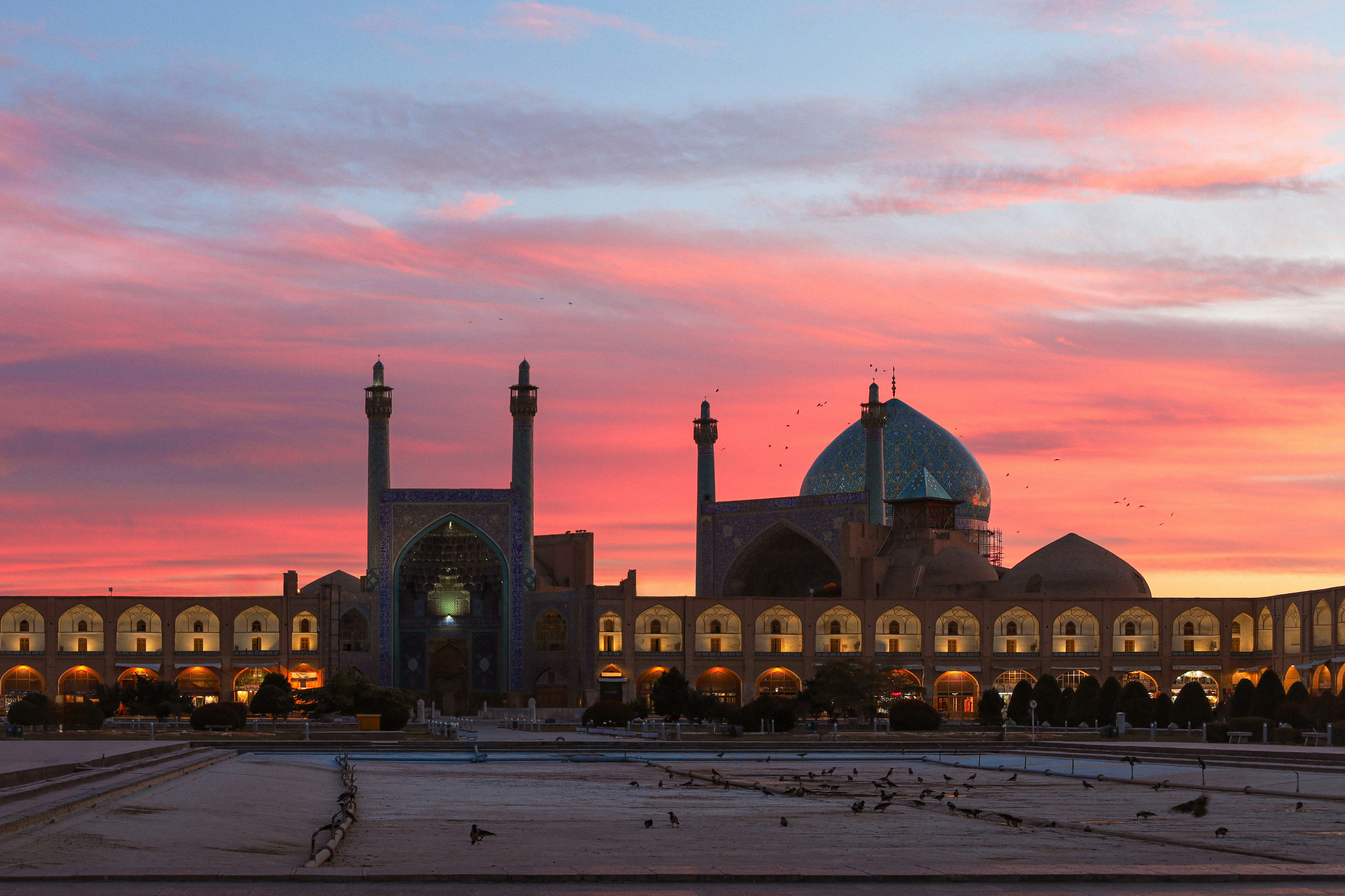 Grand mosque with colorful sunset sky above