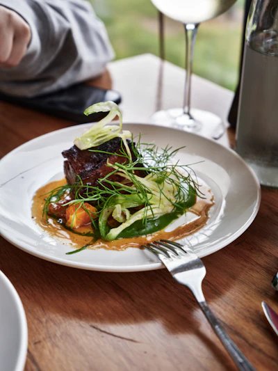 Gourmet contemporary plated dish with meat and vegetables, restaurant-style presentation