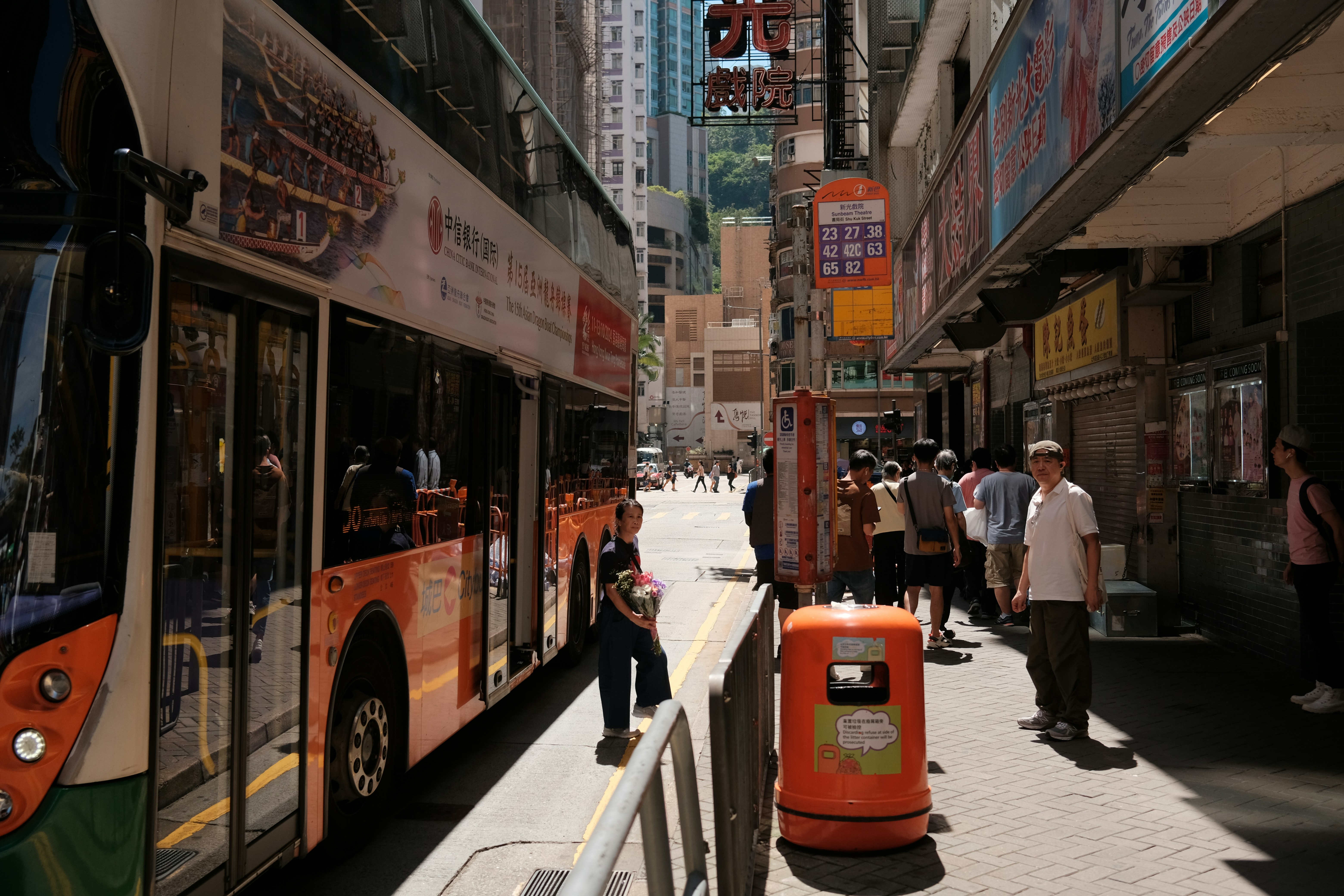 Double-decker bus on a busy city street.