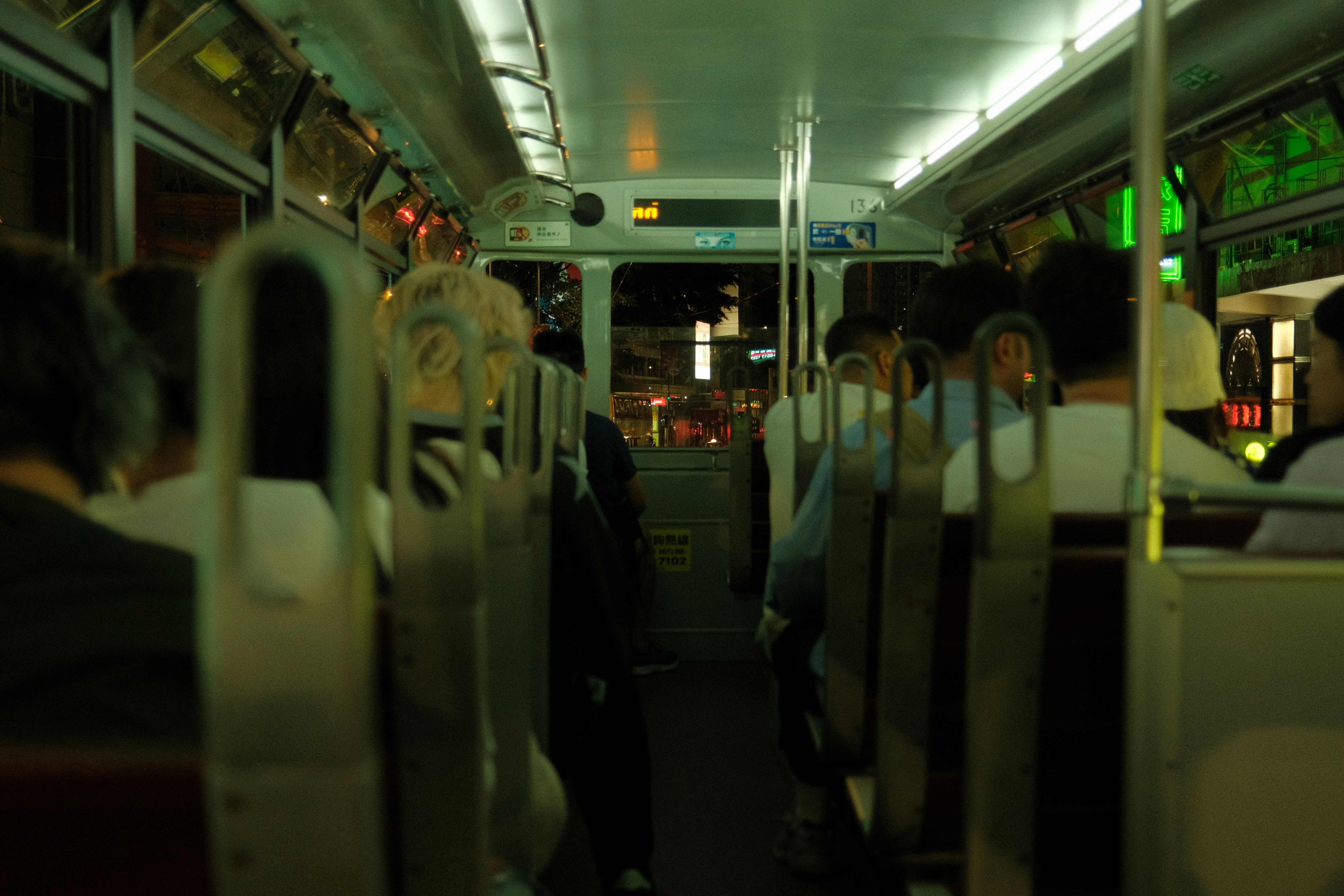 People inside a tram at night