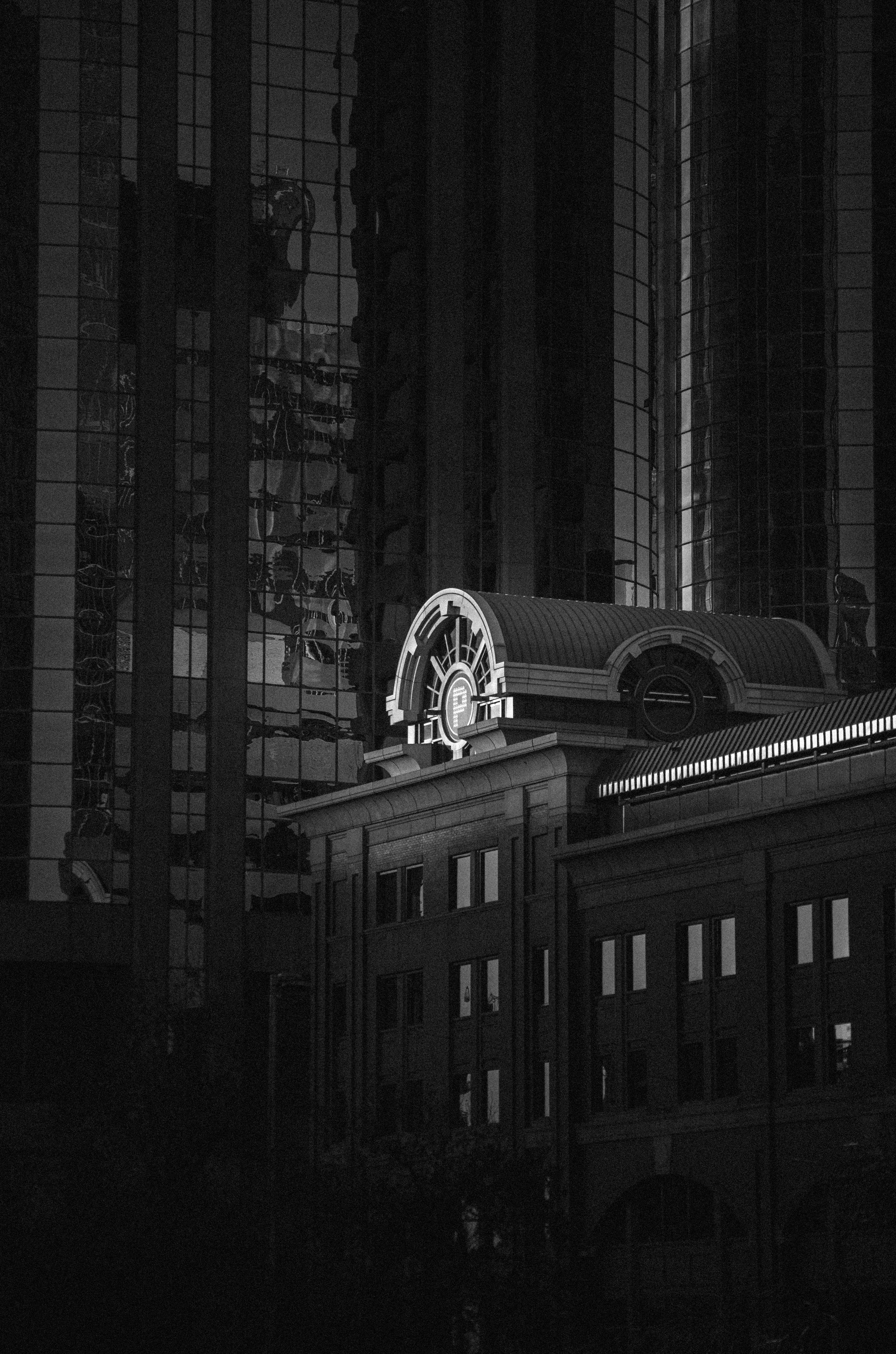Modern buildings with a unique illuminated architectural detail.