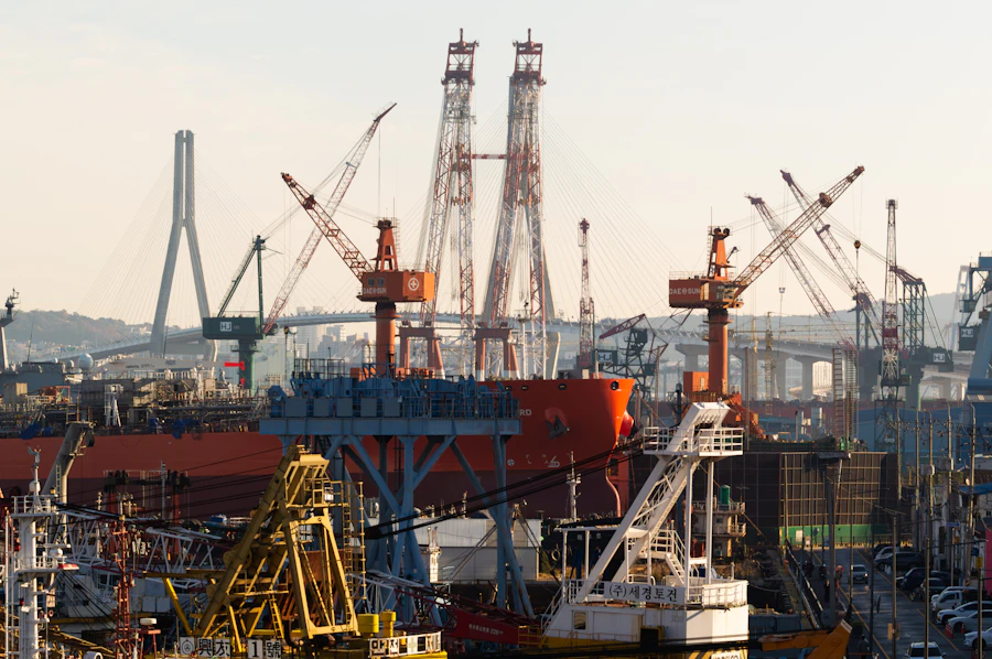 Large ship under construction in a shipyard with cranes